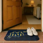 notre-dame-fighting-irish-tribal-detailing-navy-black-doormat-best-selling.webp