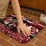 oklahoma-sooners-palm-silhouette-crimson-black-doormat-best-selling.webp