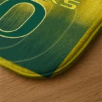 oregon-ducks-pixel-blur-green-doormat-best-selling.webp