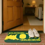 oregon-ducks-plate-rip-green-doormat-best-selling.webp