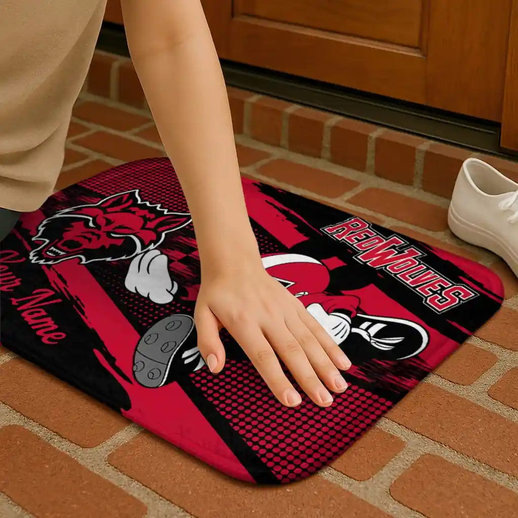 personalized-arkansas-state-red-wolves-mickey-quarterback-scarlet-black-doormat-premium-grade.webp