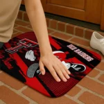 personalized-texas-tech-red-raiders-mickey-quarterback-red-black-doormat-best-selling.webp