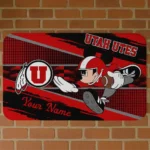 personalized-utah-utes-mickey-quarterback-red-black-doormat-best-selling.webp