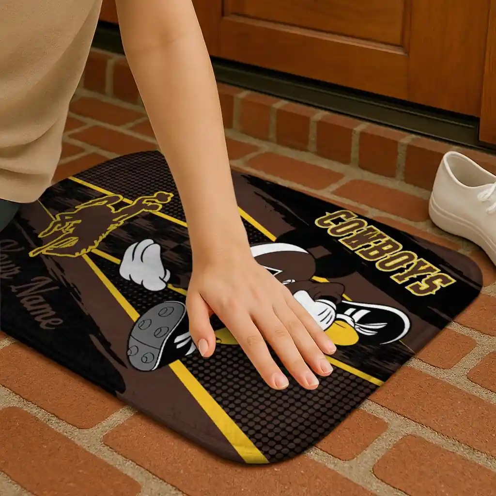 personalized-wyoming-cowboys-mickey-quarterback-brown-black-doormat-premium-grade.webp