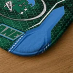tulane-green-wave-hexagon-oval-green-doormat-best-selling.webp