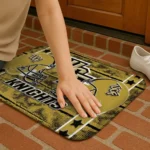 ucf-knights-helmet-illustration-gold-doormat-best-selling.webp