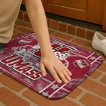 umass-minutemen-helmet-illustration-red-doormat-best-selling.webp