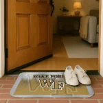 wake-forest-demon-deacons-pixel-blur-gold-doormat-best-selling.webp